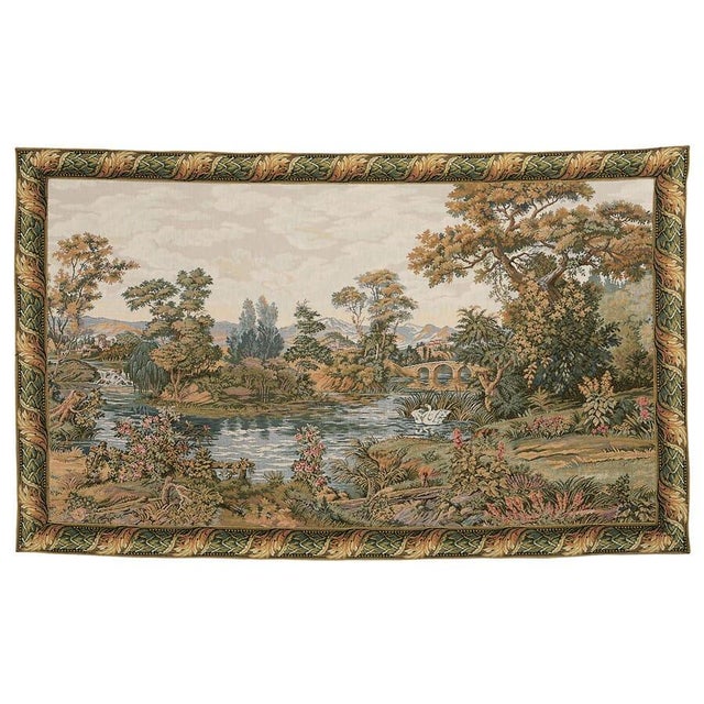 This rustic scene with a meandering river softly flowing through undulating countryside evokes the tranquil atmosphere of...