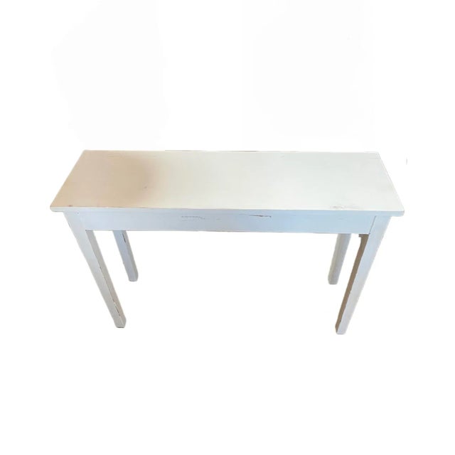 Painted white writing desk that could also be used as a small table. This table has no drawers.