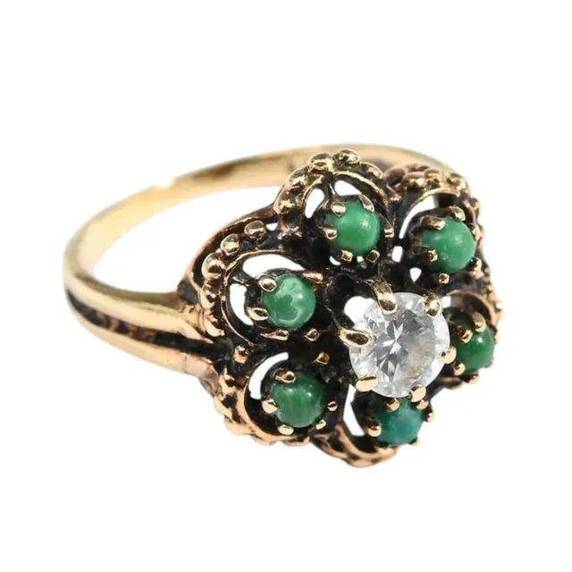 Vintage 14 karat Yellow Gold Diamond and Turquoise Cocktail Ring. Ring contains one round brilliant cut diamond at 0.43...