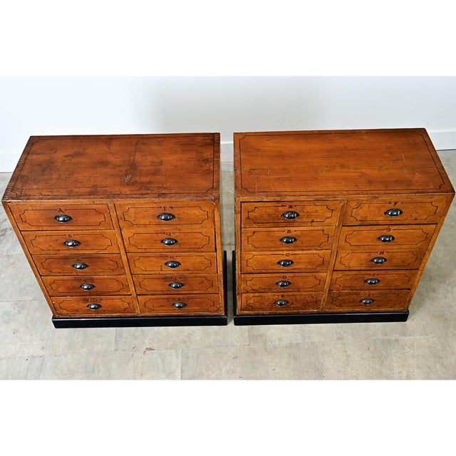 This pair of 19th-century English pine file drawers would be a unique addition to any space. The tops are made from single...