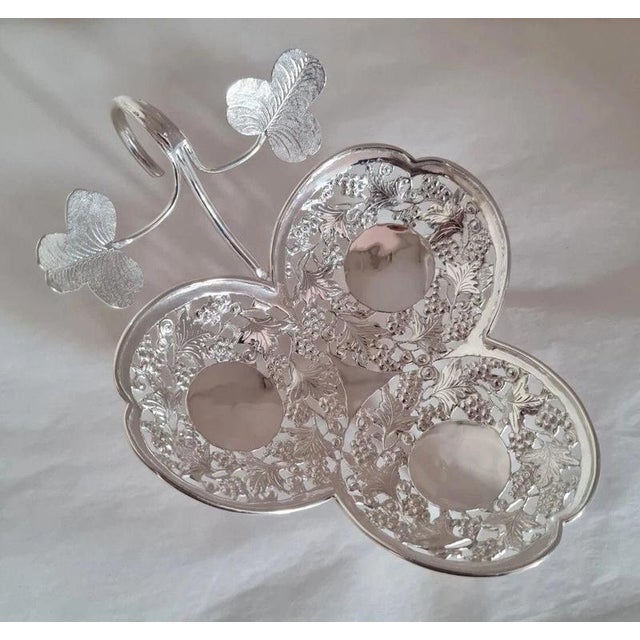 A fine late 19th-century Chinese export silver trefoil dish by the renowned silversmith and retailer Wang Hing & Co.,...