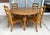 This seven-piece solid pine dining set, made in Mexico, features a generous round tabletop, warm natural finish, and six...