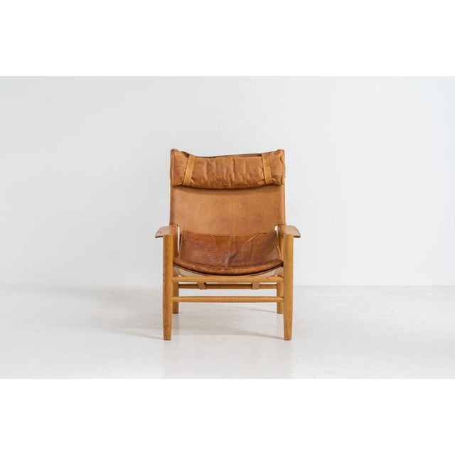 “dormi” lounge chair by kenneth bergenblad for dux (sweden, 1970s). Rare “dormi” lounge chair with a solid oak frame and...
