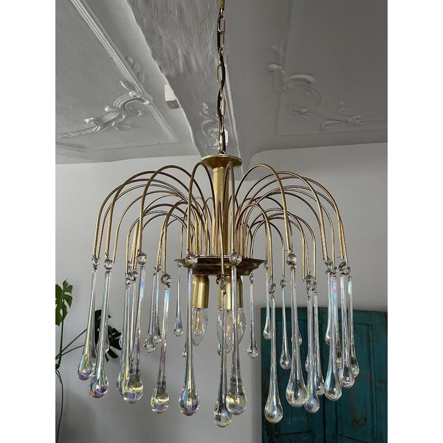 The Paolo Venini chandelier is a stunning work of art and a true statement piece that will add a touch of glamour to any...