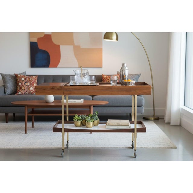 This elegant mid-century style bar cart has been fully restored by our professional craftsmen and newly finished to...