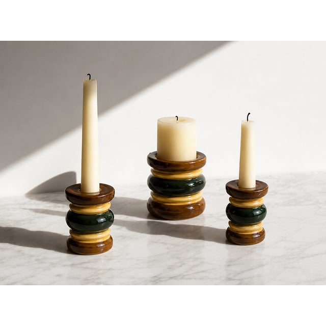 This exceptional, highly collectible set of three modular ceramic candle holders represents a quintessential example of...