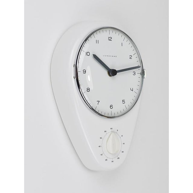 An iconic minimalist Bauhaus-inspired wall clock and timer from the 1950s, designed by Max Bill and manufactured by...