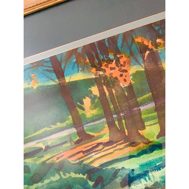 Lucious hues of green, blue, brown, and orange in this artist signed vintage watercolor of a stand of trees reflected in...