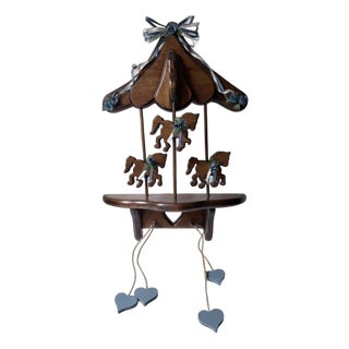 Wooden Wall Shelf a Vintage Carousel, Featuring a Canopy Top, Three Cut-Out Carousel Horses Blue Floral Ribbons, and Dangling Heart Accents. For Sale