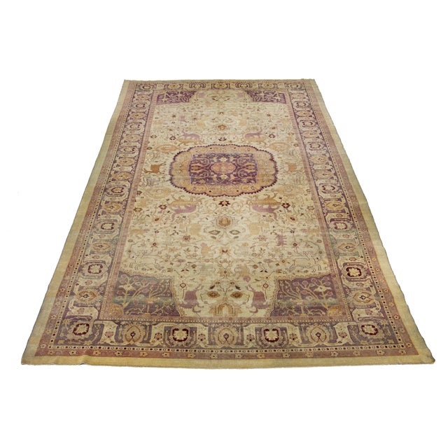 This beautifully handcrafted Agra wool rug displays a classic floral pattern. The contrast created by the beige background...