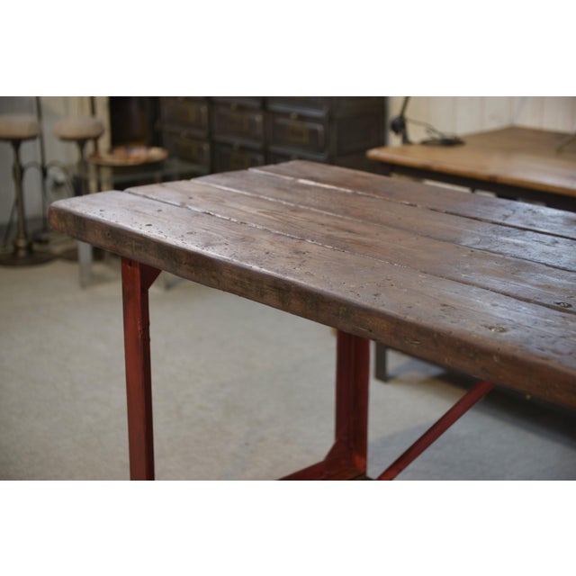 A 1950s workbench with a distinctly industrial character. Thick wooden top with a beautiful patina from use.