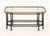 Hollywood Regency Faux Bamboo Coffee Table, the glass top with brass gallery and above an ebonized wood base. 18.25" H x...