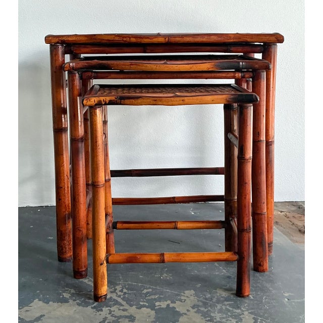 This charming set of three vintage nesting tables is a beautiful embodiment of the 1970s Bohemian and Coastal design...