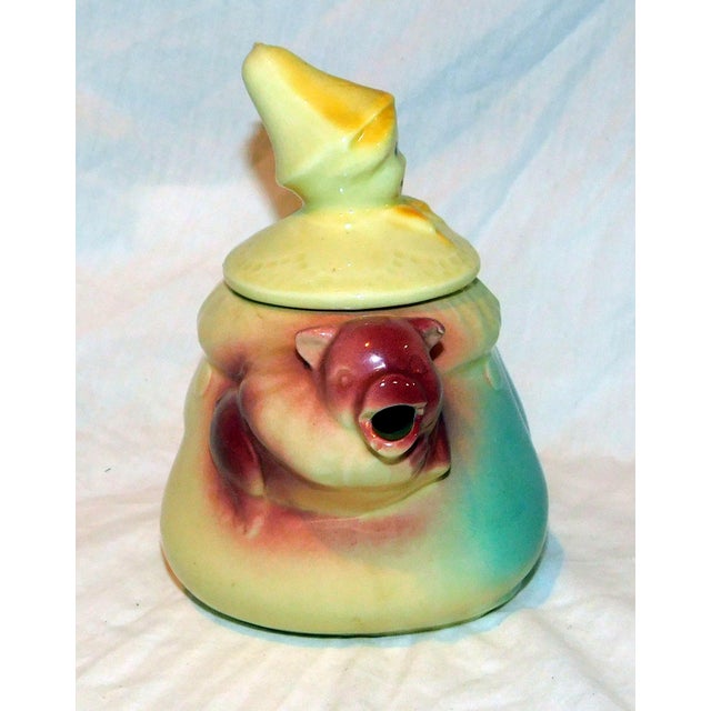 The cutest 1940's teapot by Shawnee Pottery featuring "Tom the Piper's Son" going to market with his pig