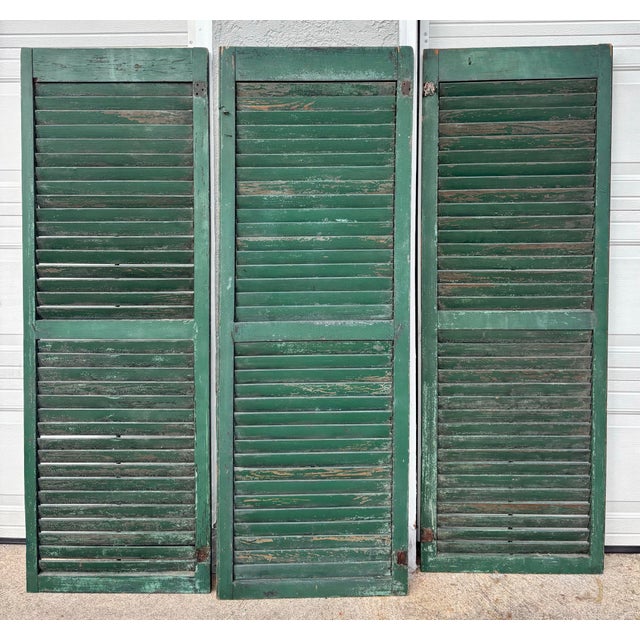 Antique American farmhouse shutter from a Pennsylvania farmhouse. Set of 3. Circa 1800. Lovely green color. All louvers...