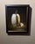 This artwork presents a beautifully rendered depiction of a halved white pumpkin, revealing its intricate interior filled...