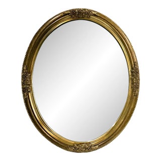 Oval Carolina Mirror Co. Beveled Glass Carved Gilt Framed Wall Mirror For Sale