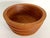 Offered is a sturdy staved and lathed Teak wood turned bowl. It features hand-carved grooved ribbed sides, an almost 1"...