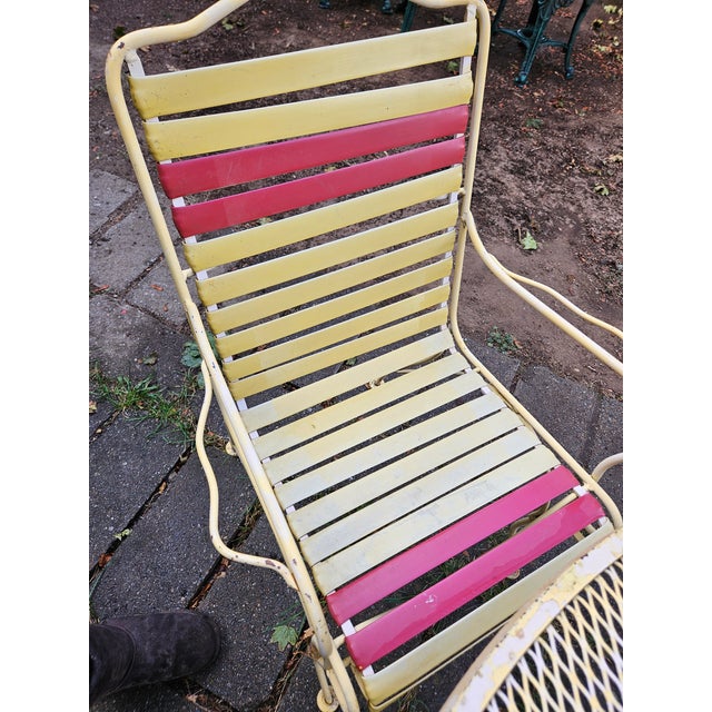 Russell Woodard vinyl strap wrought iron patio table and 4 chairs. This set is from the 1960s designed by Russell Woodard...