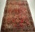 An exceptional antique Persian Sarouk rug from the first quarter of the 20th century, handwoven with remarkable...