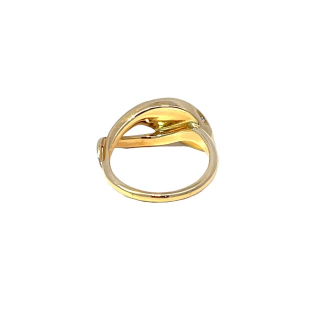 Embrace elegance with our stunning 18k yellow gold snake ring, featuring a captivating 0.16ctw diamond at its center. This...