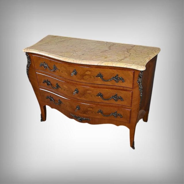 An elegant commode, crafted in the Louis XV style during the second half of the 20th century, this piece is distinguished...
