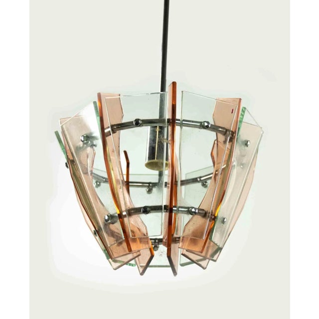 Pink and Green Chandelier is an original design lamp realized by Anonymous designer in the 1970s. A vintage lamp realized...