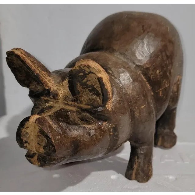 Early 20thc hand carved pig or hog with amazing patina. This is most unusual and found in the mid west.