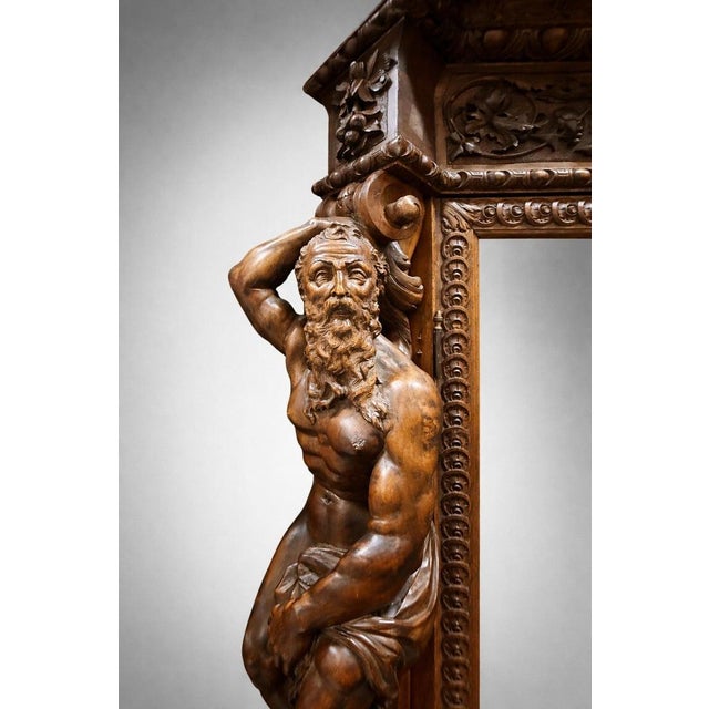 This extraordinary Luigi Frullini carved walnut display cabinet, created in Florence in the late 19th century, represents...