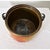 An antique French brass cooking pot with handle for suspending over the fire, dating to the second half of the 19th...