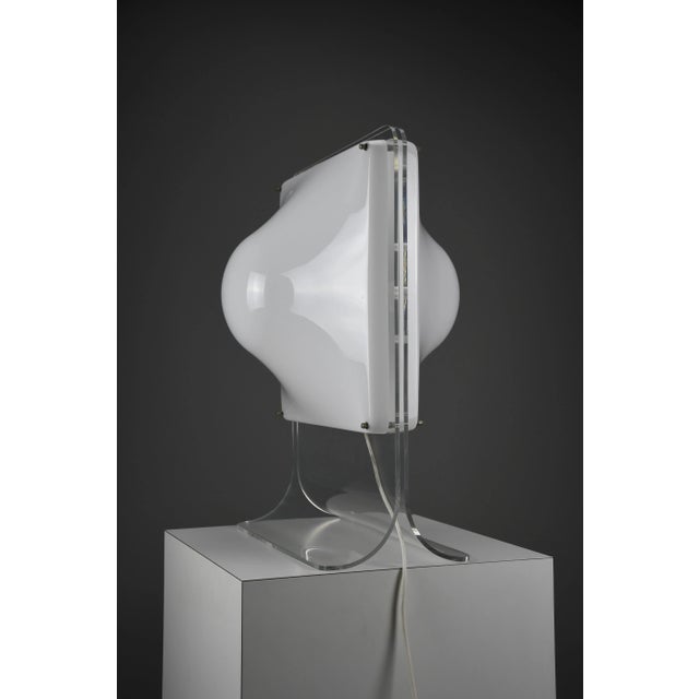 A striking sculptural table lamp, reminiscent of the iconic “bolla” series designed by elio martinelli for martinelli luce...