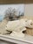 This is a vintage ceramic fish-shaped planter or cachepot with a sculptural underwater motif. It features a creamy white...