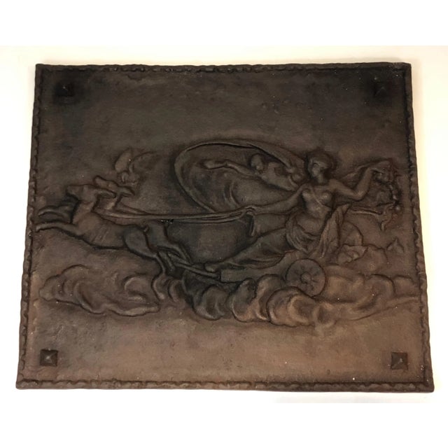 This romantic scene fireback is made of cast iron. This is a French work, circa 1950.