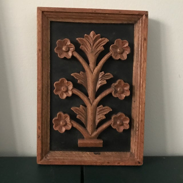Carved wood wall hangings. Set of three depicting plants, flowers. Organic spa like feel.
