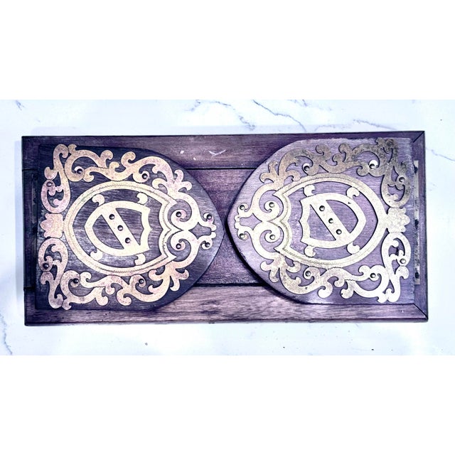 This is an antique English walnut extending book slide, also known as a novel stand or book trough, dating to the...