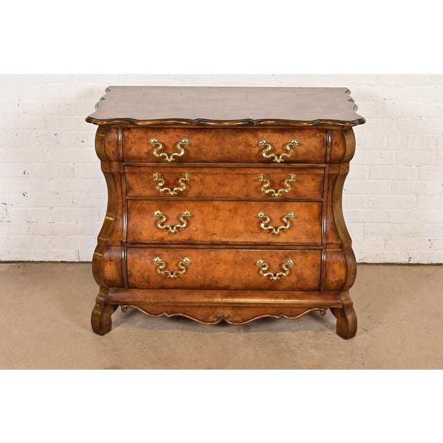 A gorgeous Dutch Baroque or Louis XV style bombay chest, commode, or dresser By Baker Furniture USA, Circa 1980s Burled...