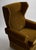 Vintage Scandinavian wingback lounge chair, circa 1950s, upholstered in warm olive-gold mohair. A tall, gently contoured...