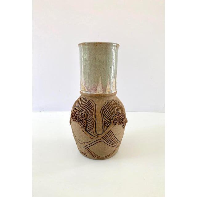 Superb carved unglazed body and glazed neck on this handmade studio pottery vintage vase, signed "Moni." The different...