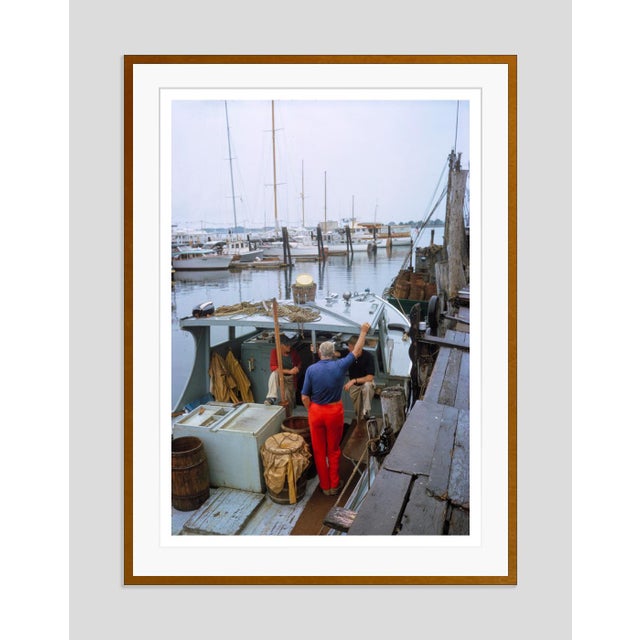 Howard Gardiner Cushing by Toni Frissell Artist and prominent social figure Howard Gardiner Cushing stands on a boat dock...