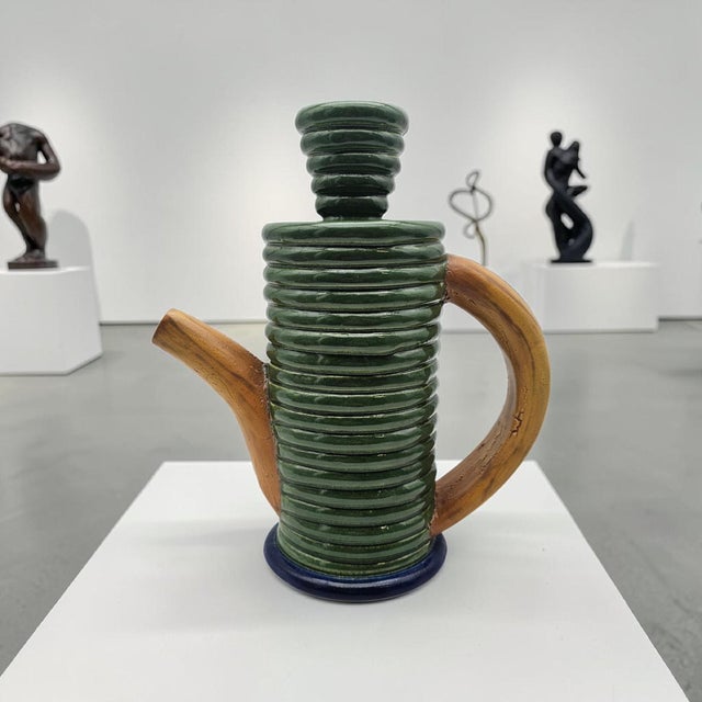 A signed sculptural teapot by American studio ceramicist Jamie Walker, executed in a distinctive coiled, ribbed form that...