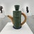 A signed sculptural teapot by American studio ceramicist Jamie Walker, executed in a distinctive coiled, ribbed form that...