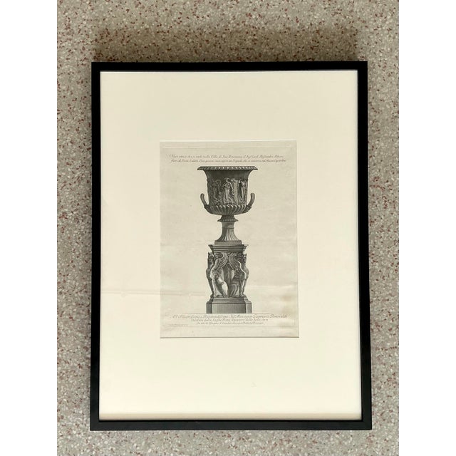 This monumental framed print, after the masterful Giovanni Battista Piranesi, captures the dramatic essence of the Roman...