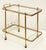 A fine vintage French bar trolley or drinks cart (also known as a serving or tea trolley) of brass with glass shelves, in...