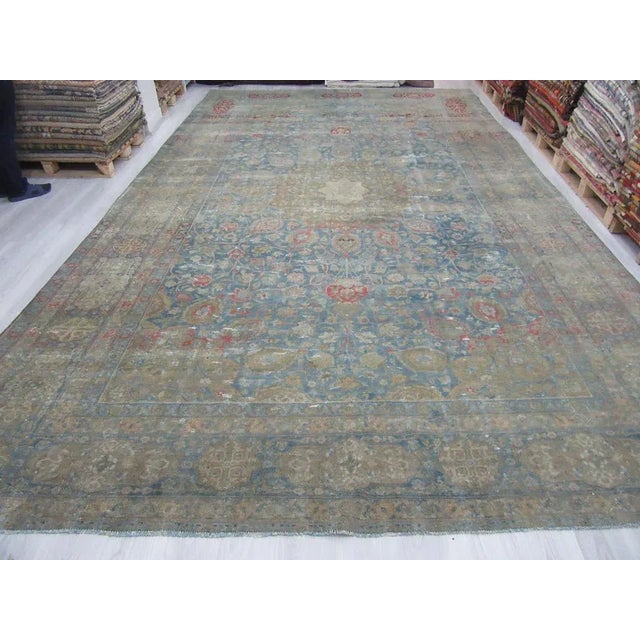 Distressed antique Persian Tabriz rug. Approximately 80-90 years old. In very good condition