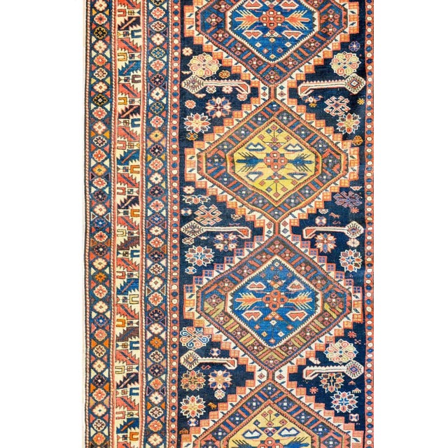 An amazing early 20th century Shirvan rug with an incredible bold and graphic stylized floral and leaf patterns woven in...