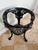 A hand painted, ‘Britannia’ cast iron occasional table. (Matching pair available).