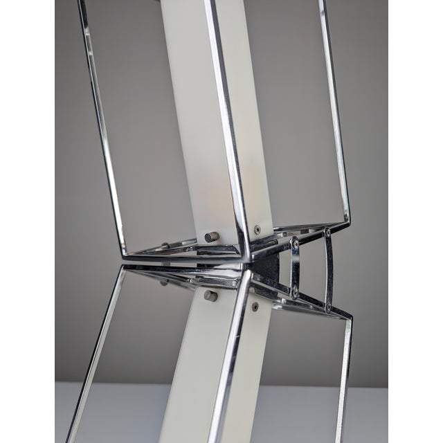 Architectural design lamp from the 20th century, made of chromed metal forming two inclined cubes that create an...