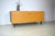 This is a compact sideboard from the 1960s, manufactured by VEB Deutsche Werkstätten Hellerau. The cabinet features a...