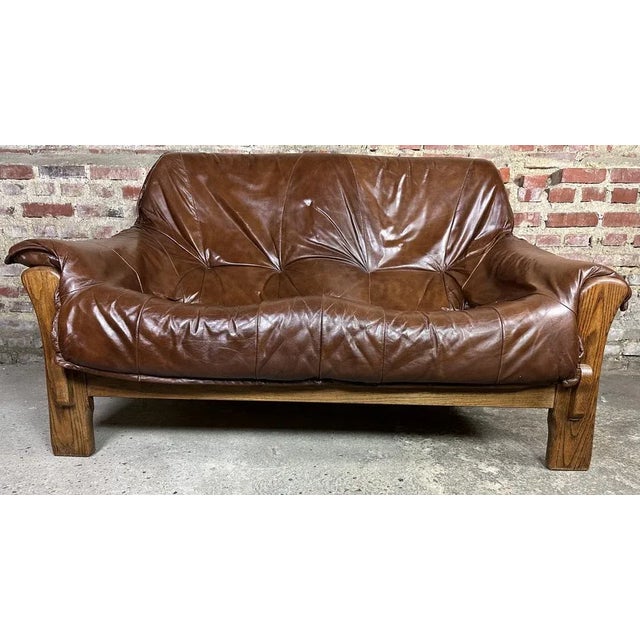 Vintage 1960 wooden and leather sofa in the taste of Percival Lafer. Oak reinforcement and the back of the sofa is in...