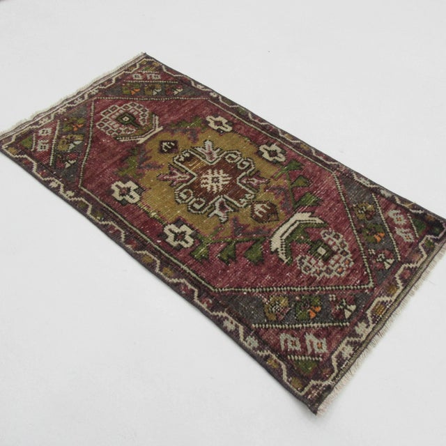 Handknotted vintage decorative mini rug from Kars region of Turkey. Approximately 50-60 years old. In very good condition.